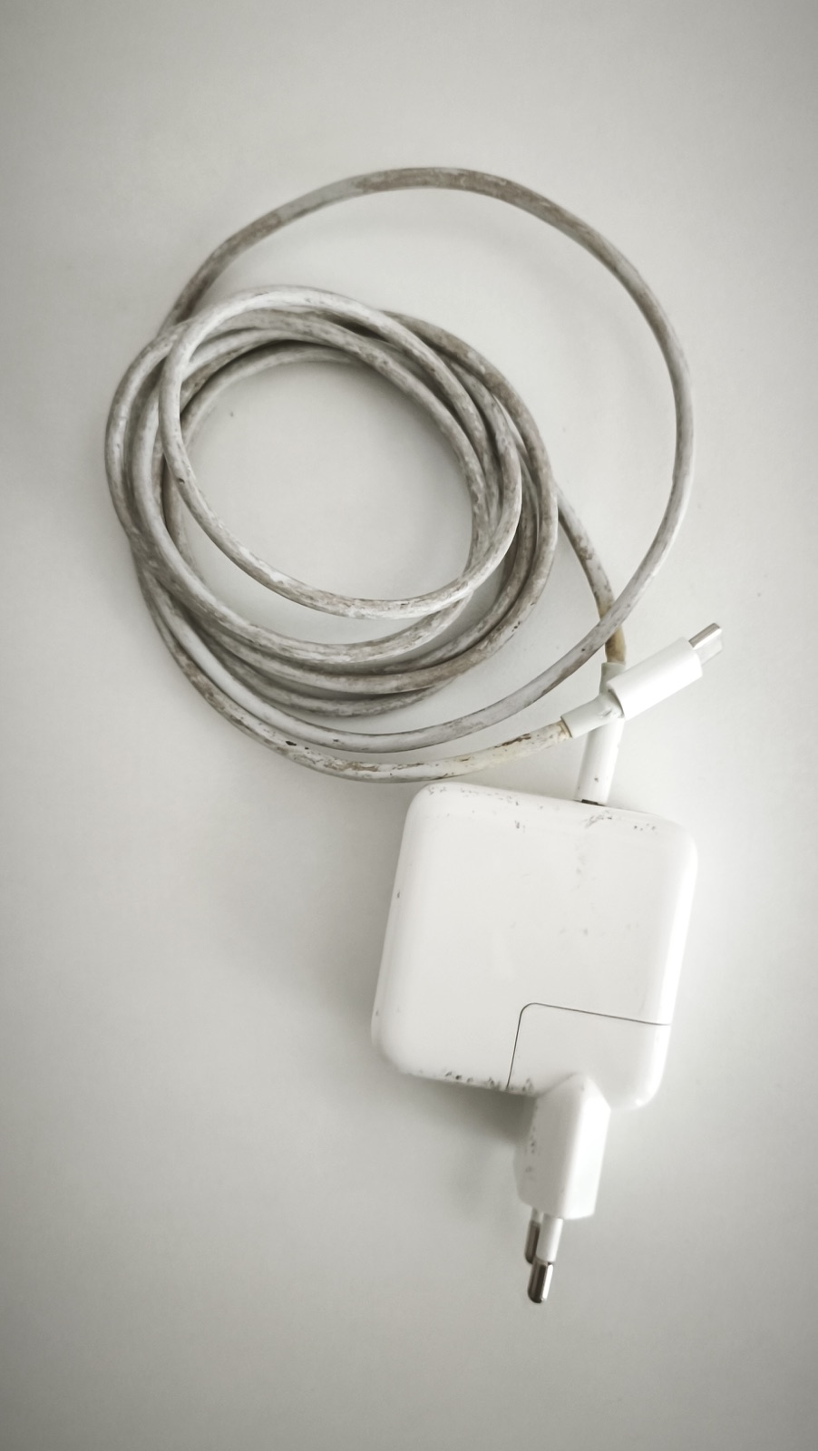 Before: The "classic" gray dirt and greebles that start to stick to your MacBook charger over time.